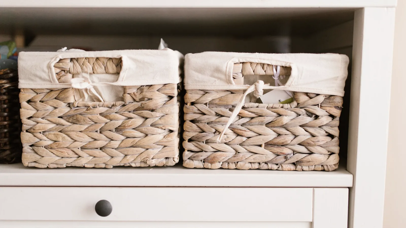 Closed storage baskets and bins organized on open shelving